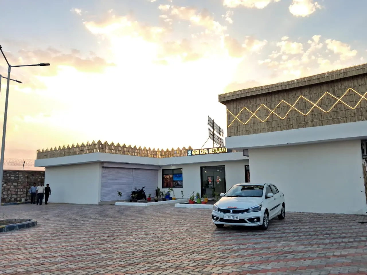 Guru Kripa Restaurant and its free parking at sunset