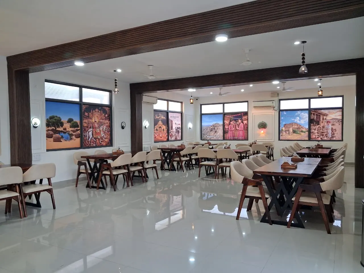 AC family restaurant hall at Guru Kripa, Pachpadra, with Rajasthani wall art